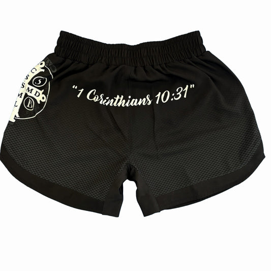 Black shorts with '1 Corinthians 10:31' text on a white background