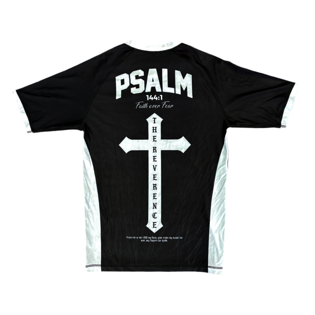 Black t-shirt with white cross design and text on a white background