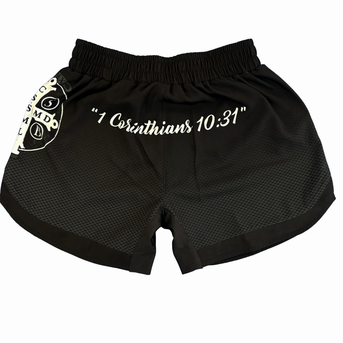 Black shorts with '1 Corinthians 10:31' text on a white background
