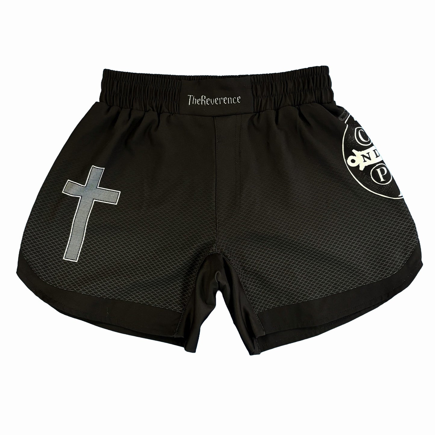 Black athletic shorts with a cross design and branding on a white background