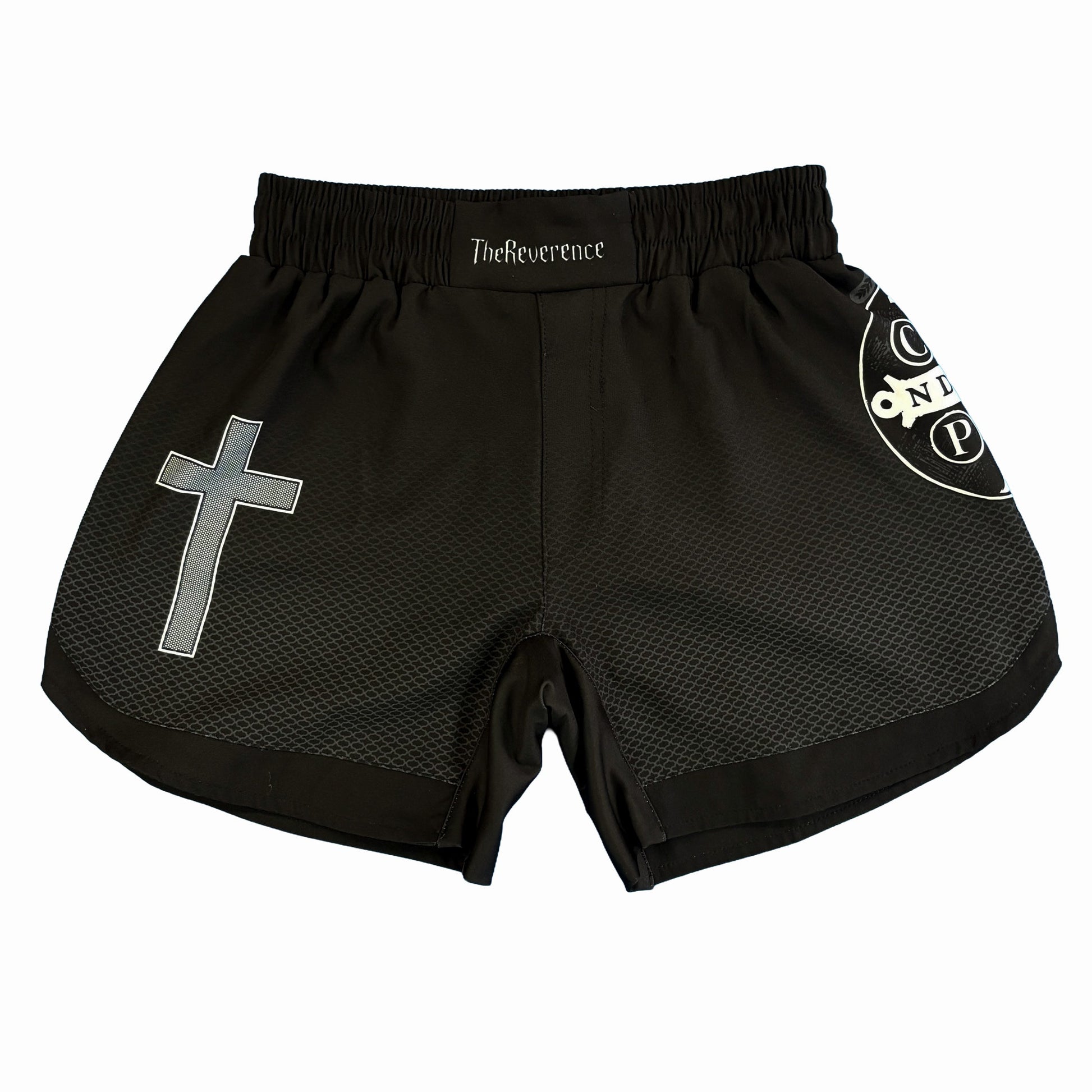 Black athletic shorts with a cross design and branding on a white background