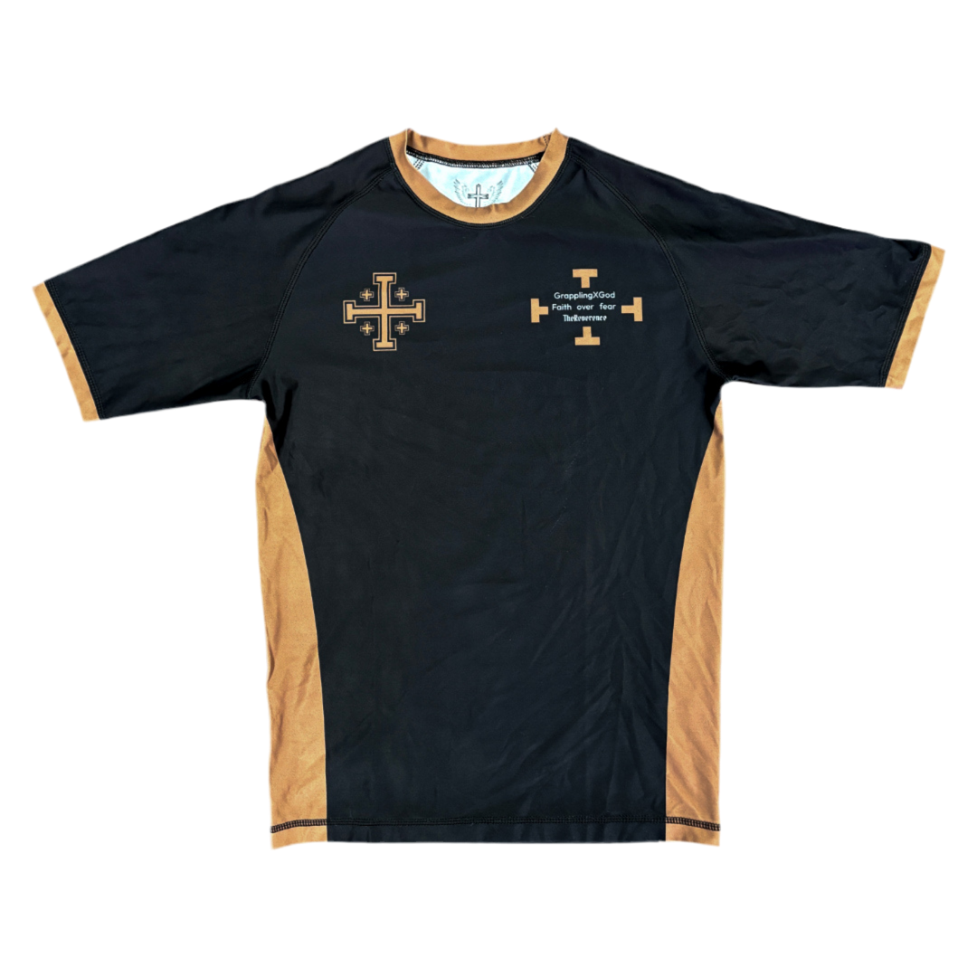 Black and beige sports shirt with a cross design on a white background