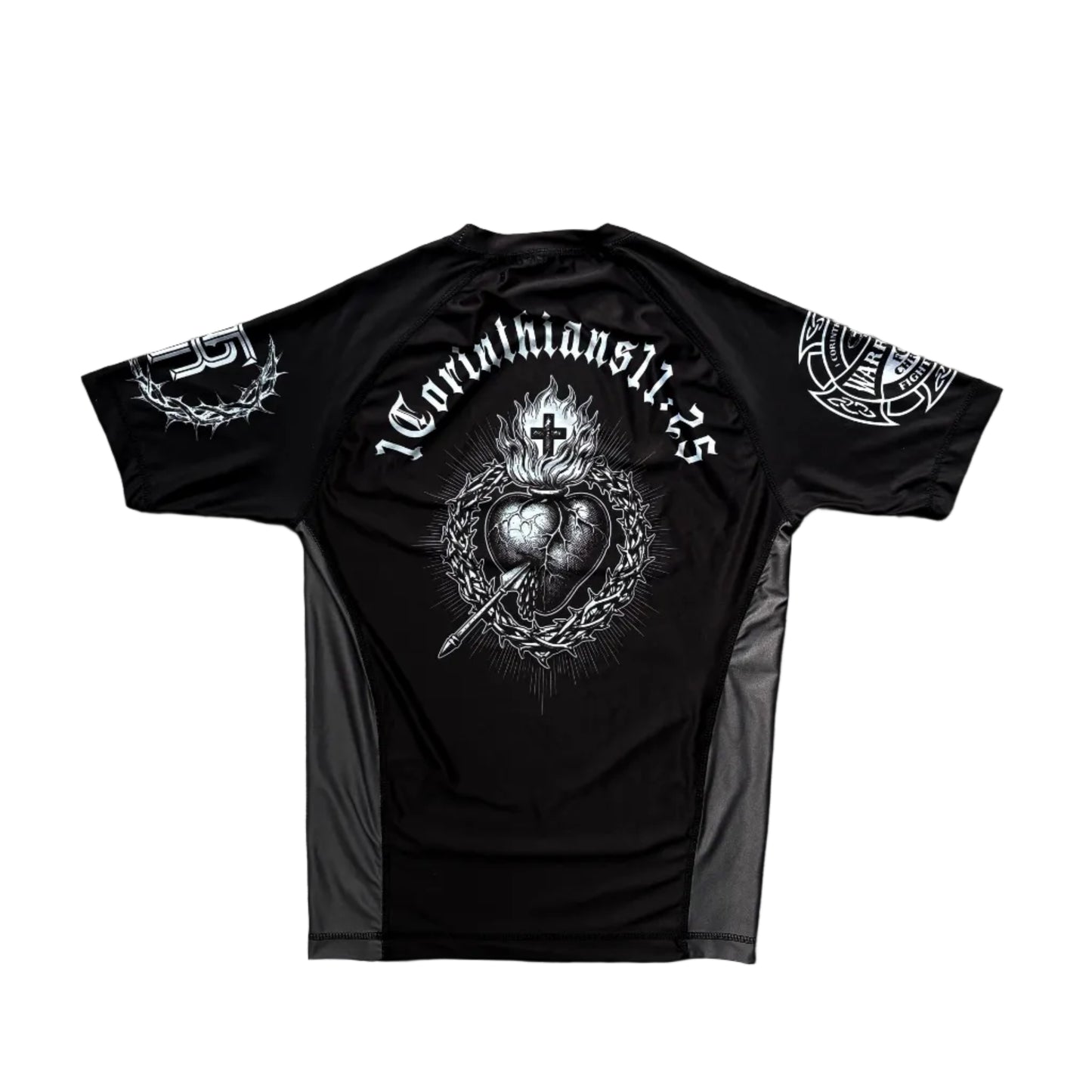 Black t-shirt with white graphic design on a wooden surface