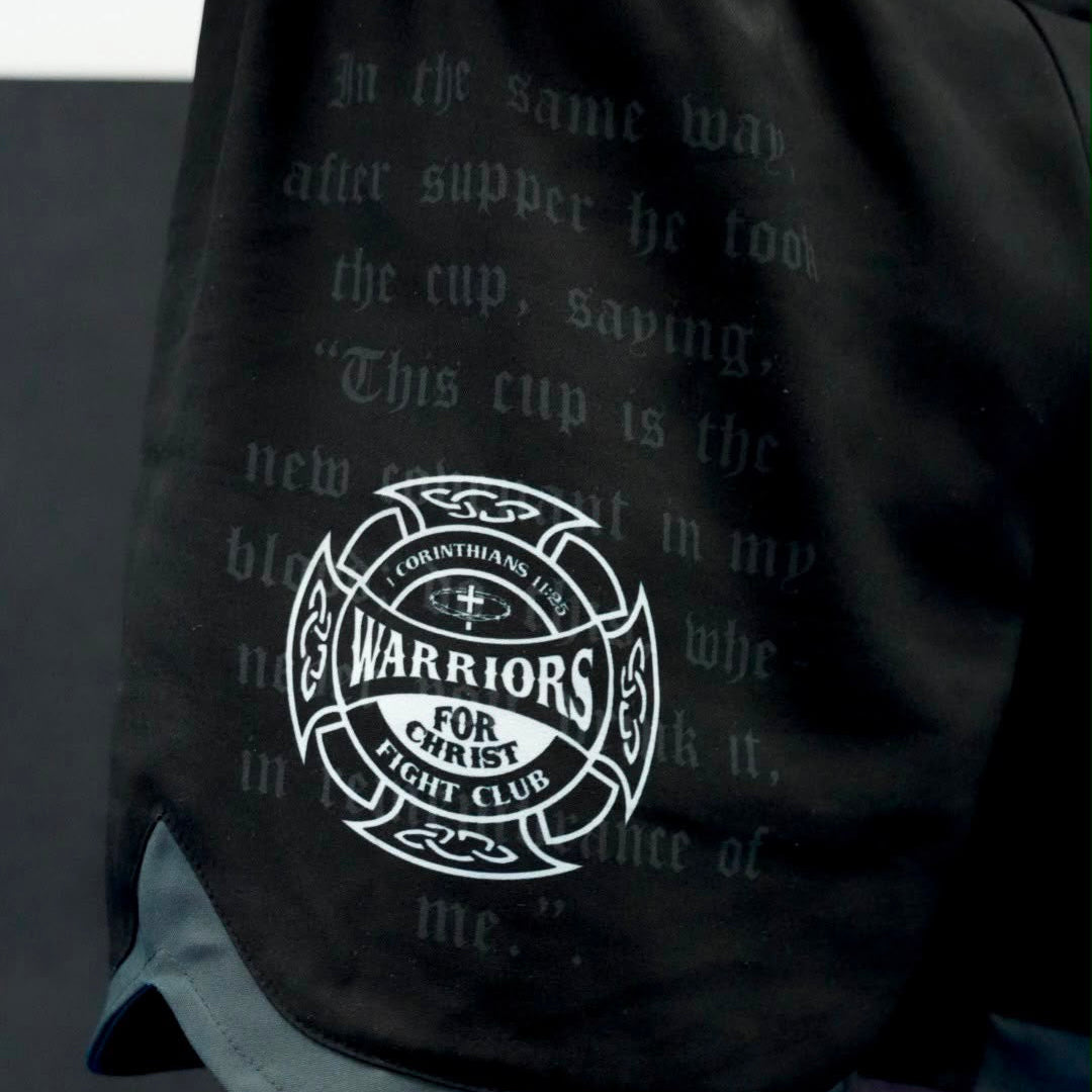 Black drawstring bag with white text and logo on a dark background