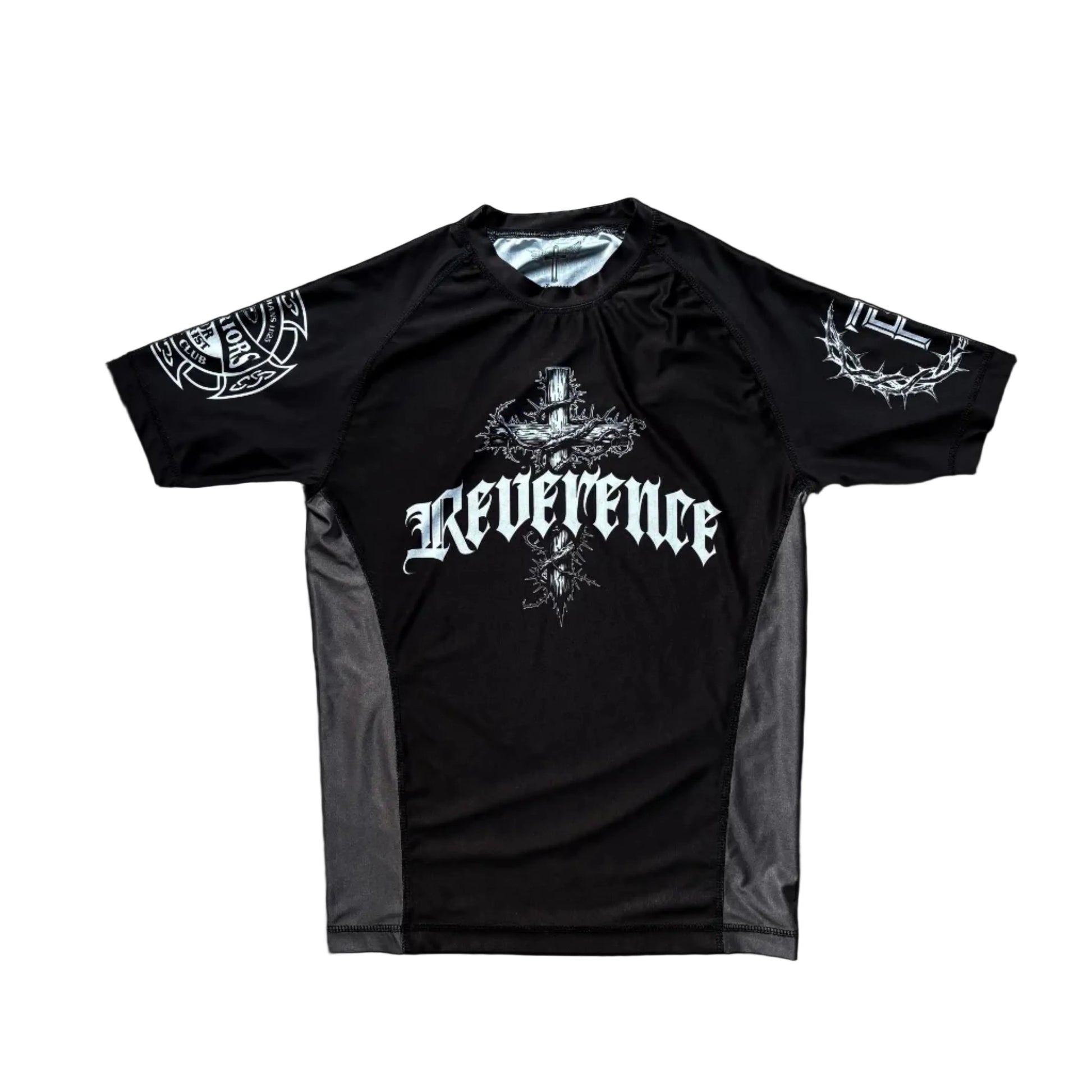 Black t-shirt with 'Reverence' text on a wooden surface