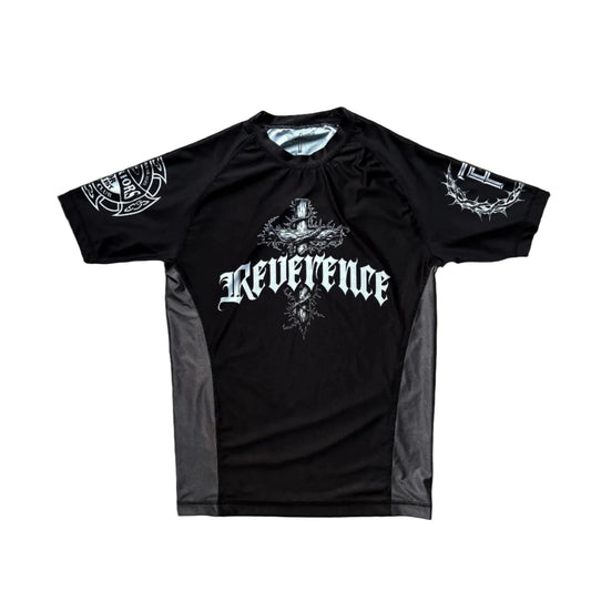 Black t-shirt with 'Reverence' text on a wooden surface