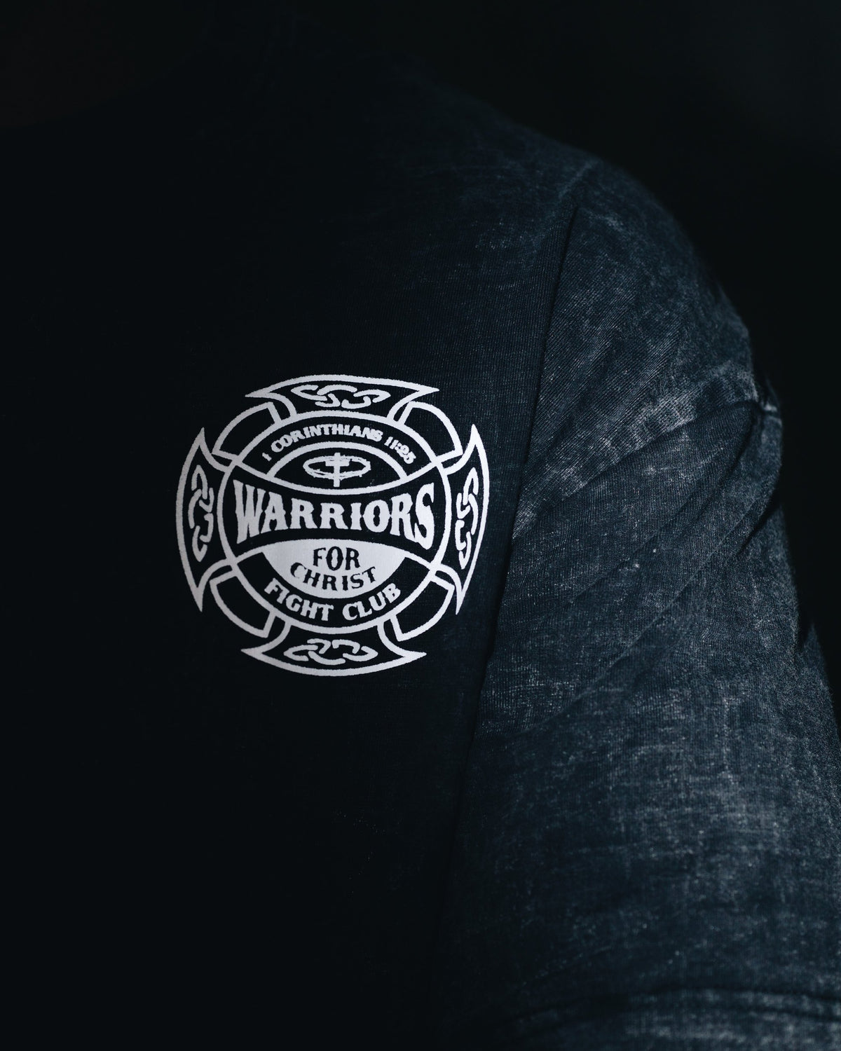Warriors for Christ Fight Club crest on the chest of a black tee